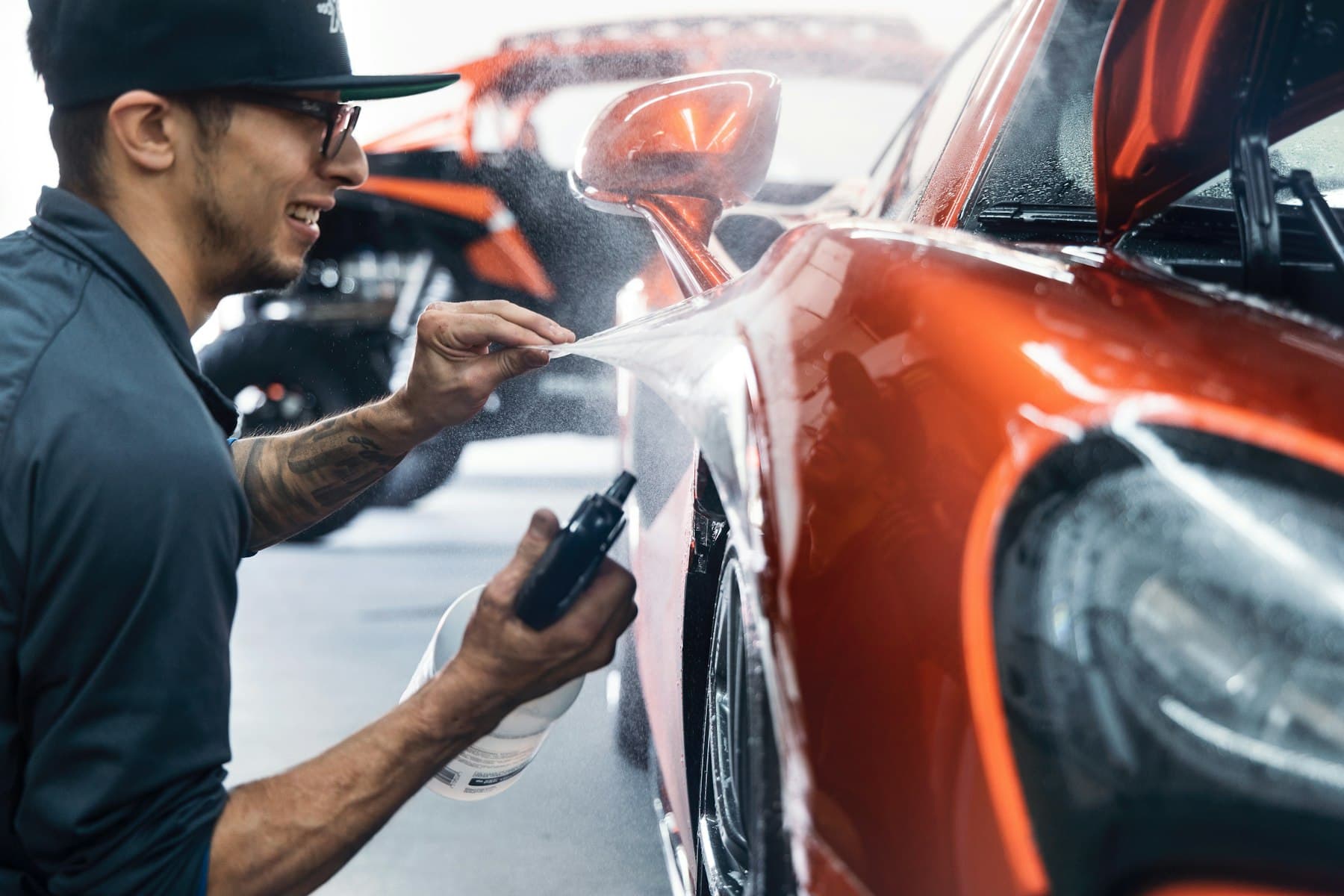 Car paintwork being waxed by hand after an exterior wash in Saint John